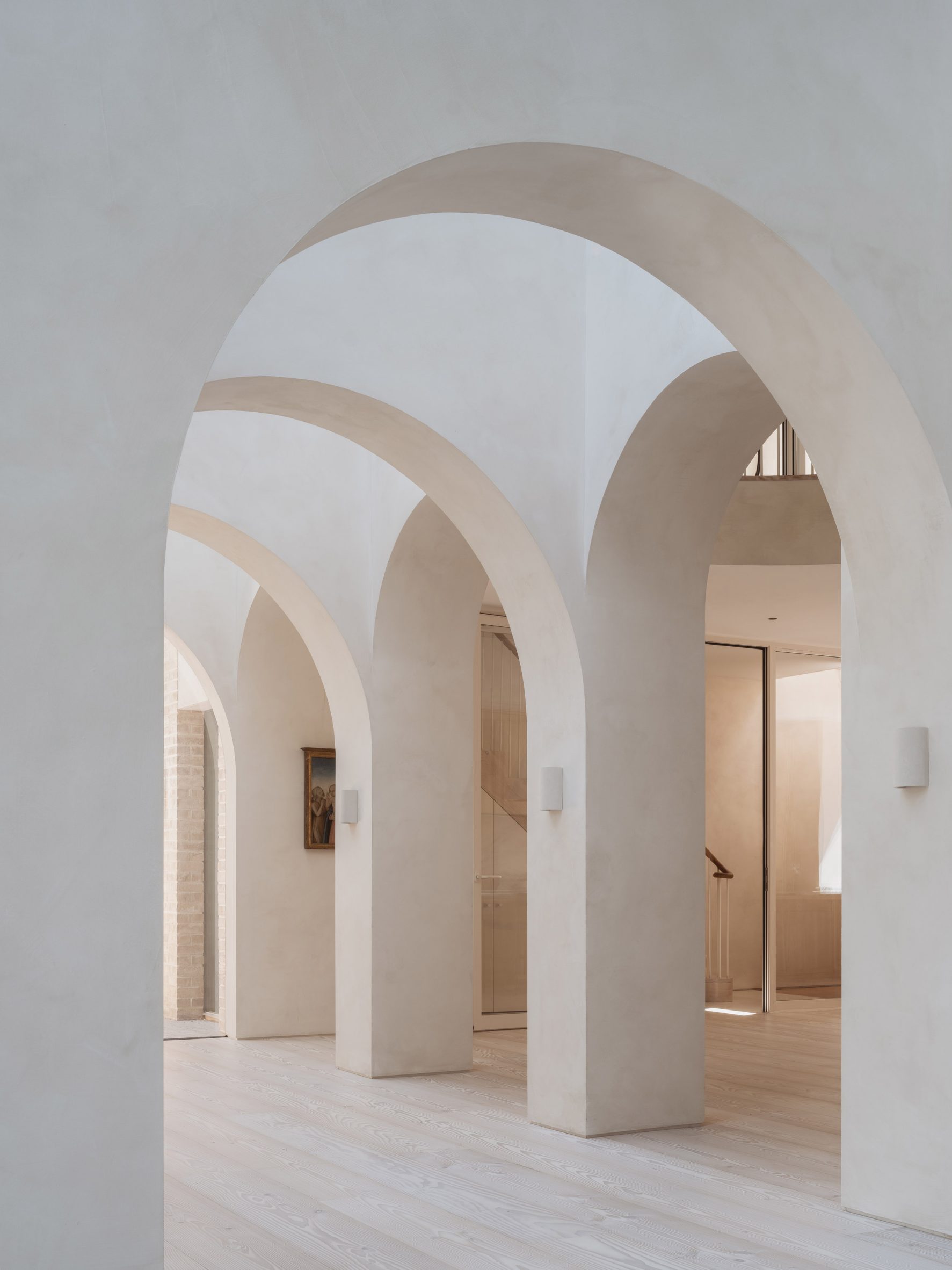 Architecture studio Goldstein Heather has transformed a Victorian terrace house in London, adding a four-storey extension with arched openings and a sculptural timber staircase. Named West London House, the home in Stamford Brook was overhauled by Goldstein H…